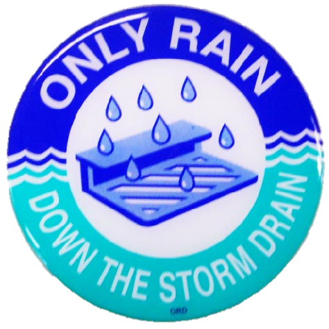 Circle marker for catch basins showing a storm drain grate with the words "Only rain down the dra